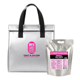 A silver insulated tote with black handles and a pink Craft & Culture logo sits next to the 8 Day “Immunity Boost” Milk Kefir Detox from Craft & Culture - Kombucha, Kefir & Probiotics Singapore.