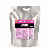 A silver pouch labeled “Original Whole Milk Kefir - 1L” from Craft & Culture - Kombucha, Kefir & Probiotics Singapore features a pink label with probiotic info, usage instructions, and nutrition details.