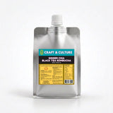 A silver pouch with a white cap, labeled “Ginger-Chia Black Tea Kombucha” by Craft & Culture - Kombucha, Kefir & Probiotics Singapore. Its teal and brown label emphasizes this probiotic, anti-inflammatory tea above yellow nutrition facts.