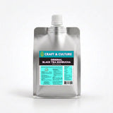 A silver spouted pouch of Original Black Tea Kombucha by Craft & Culture - Kombucha, Kefir & Probiotics Singapore stands upright on white, featuring blue, white, and black probiotic tea drink details.