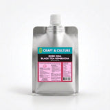 A silver pouch with a white spout labeled “Rose-Chia Black Tea Kombucha” from Craft & Culture - Kombucha, Kefir & Probiotics Singapore stands against a white background, highlighting this vibrant probiotic tea and its details.