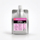 A silver pouch with a white cap is labeled “Original Whole Milk Kefir” from Craft & Culture - Kombucha, Kefir & Probiotics Singapore, featuring probiotics and nutritional details on its pink and black label.
