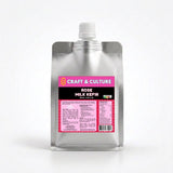 A silver pouch with a white cap displays a pink label reading “Rose Bandung Whole Milk Kefir” by Craft & Culture - Kombucha, Kefir & Probiotics Singapore, with ingredients and nutrition facts printed on the front.