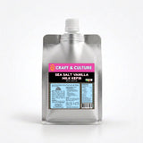A silver pouch with a white cap features Craft & Culture - Kombucha, Kefir & Probiotics Singapore Vanilla Sea Salt Whole Milk Kefir. The vibrant label shares nutritional facts and digestive health benefits.
